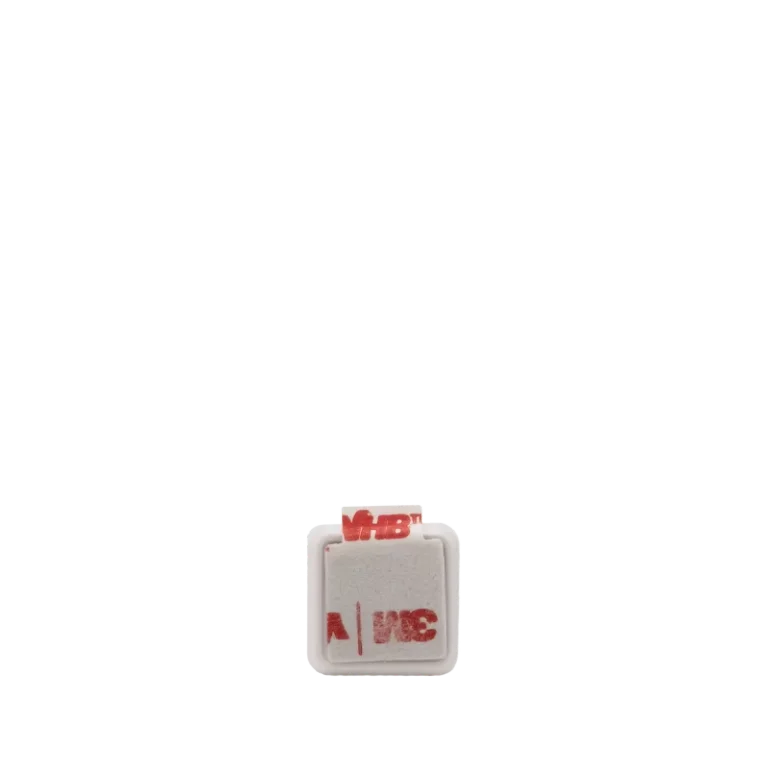 Adhesive tape used to attach the magnet of a door sensor for secure placement.